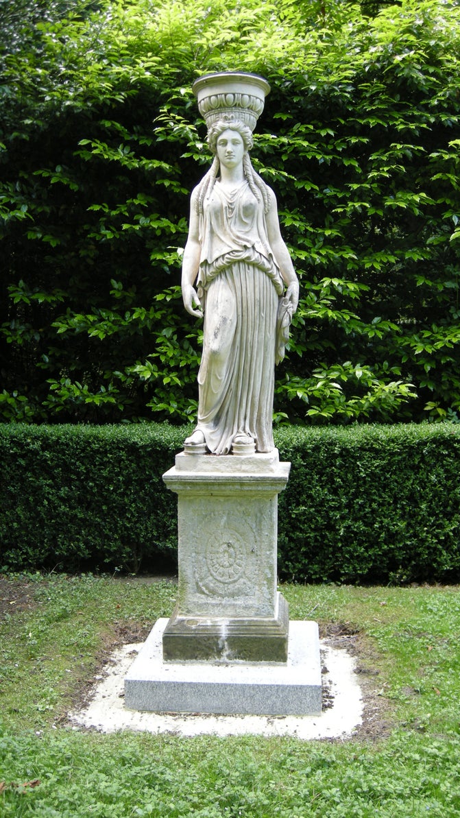 Coade stone scuplture of a caryatid at Anglesey Abbey, Cambridgeshire